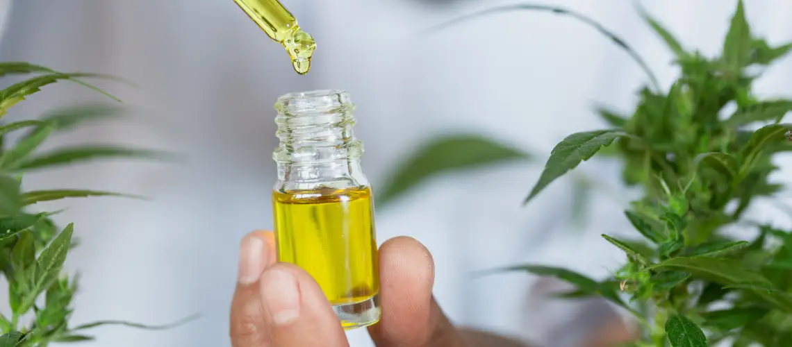 Australian patient holding a cannabis bottle during consultation